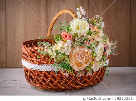 Decorative basket decorated with flowers Decorative basket decorated with flowers 39283281
