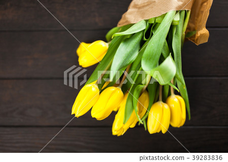 Yellow tulips on wooden background 39283836