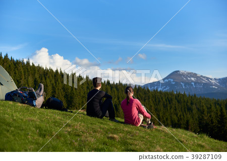 Female friends hiking together in the mountains Female friends hiking together in the mountains 39287109