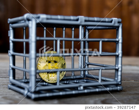 The coin is in the gray nick color put on a wooden 39287147