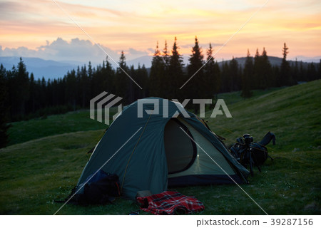 Tent on a camping site in the mountains Tent on a camping site in the mountains 39287156