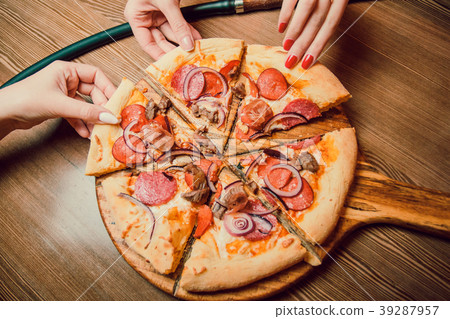 People Hands Taking Slices Of Pizza Margherita People Hands Taking Slices Of Pizza Margherita 39287957
