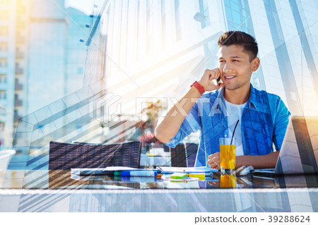 Smiling man talking on the phone Smiling man talking on the phone 39288624