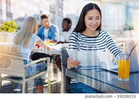 Joyful international girl working with documents Joyful international girl working with documents 39288819