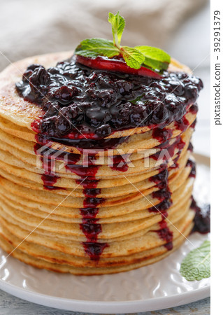 Stack of pancakes with berry sauce. Stack of pancakes with berry sauce. 39291379