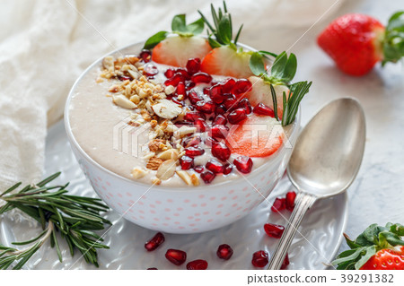 Healthy smoothie bowl of strawberries and almonds. Healthy smoothie bowl of strawberries and almonds. 39291382