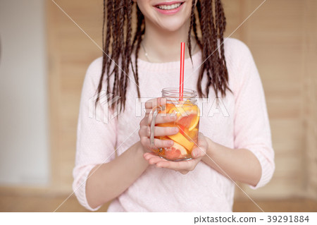 Young pretty woman holding mason jar with lemonade 39291884