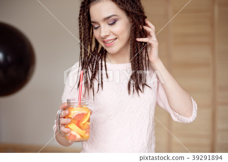 Young pretty woman holding mason jar with lemonade Young pretty woman holding mason jar with lemonade 39291894