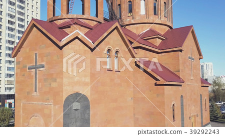 Christian temple made of red bricks with city Christian temple made of red bricks with city 39292243