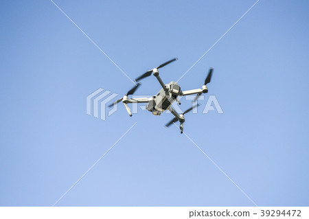 drone flying during the day on a blue sky drone flying during the day on a blue sky 39294472
