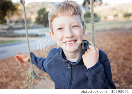 kid at swings 39298691