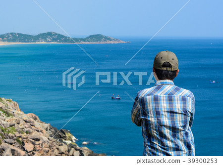 A man looking at the sea A man looking at the sea 39300253
