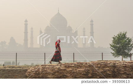 An Asian woman visit Taj Mahal An Asian woman visit Taj Mahal 39300613