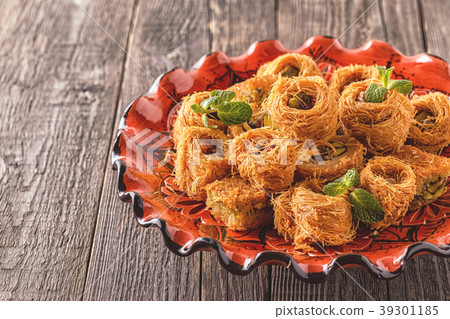 Eastern sweets on old wooden table. Eastern sweets on old wooden table. 39301185