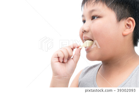 Obese fat boy eating potato chips isolated 39302093