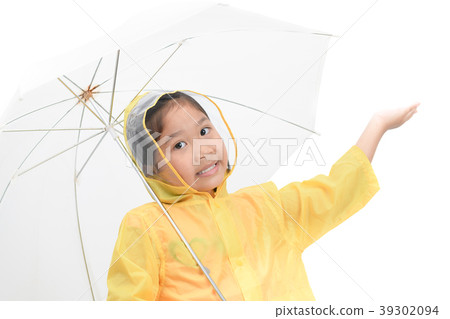 Happy girl is wearing yellow raincoat 39302094