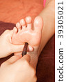 reflexology foot massage by wood stick 39305021