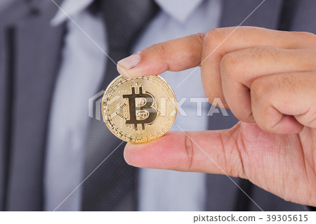 bitcoin in hand of business man bitcoin in hand of business man 39305615