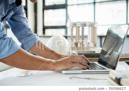 Architects engineer discussing at the table with b 39306627