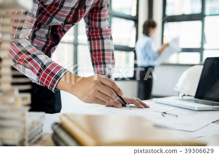 Architects engineer discussing at the table with b 39306629