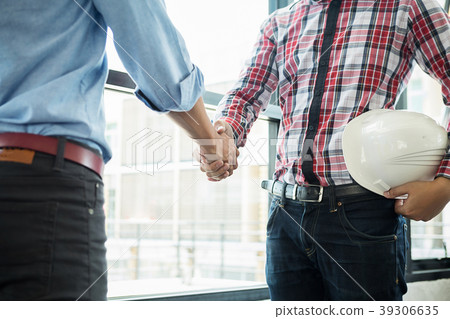 Architects engineer discussing at the table with b 39306635