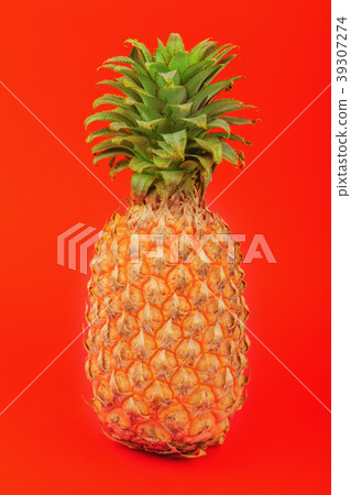 pineapple on a red background pineapple on a red background 39307274