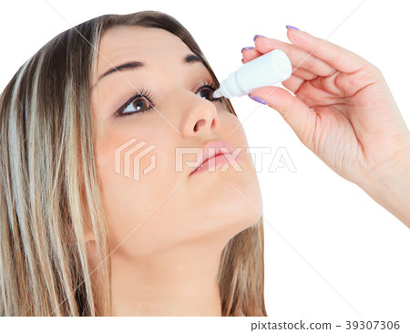 woman dripping eye with eyes drops woman dripping eye with eyes drops 39307306