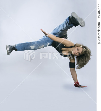 Teenage girl dancing breakdance in action 39307336