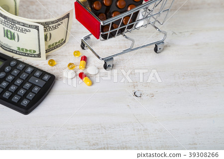Shopping trolley with pills,money and calculator Shopping trolley with pills,money and calculator 39308266