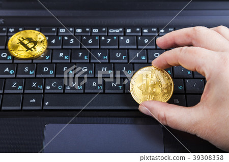 Female hand holds bitcoin 39308358