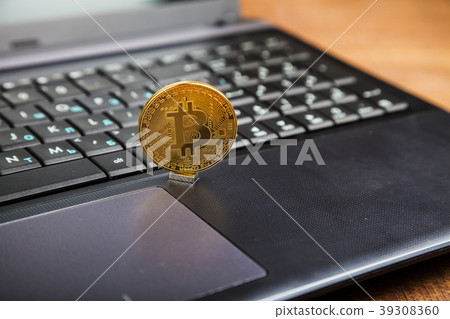 Bitcoin on a laptop Bitcoin on a laptop 39308360
