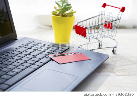 Credit card on laptop. Credit card on laptop. 39308380