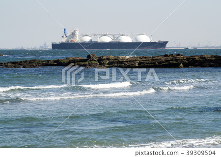 A view of a large boat running on the shore and offshore A view of a large boat running on the shore and offshore 39309504