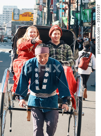 Foreign tourists on a rickshaw 39310597