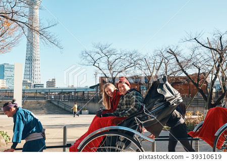 Foreign tourists on a rickshaw Foreign tourists on a rickshaw 39310619