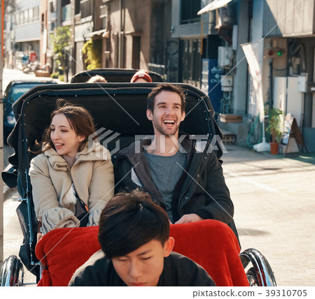 Foreign tourists on a rickshaw Foreign tourists on a rickshaw 39310705