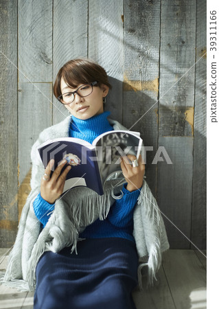 Woman relaxing in the living room Woman relaxing in the living room 39311166