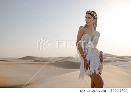 Sexy girl in a beautiful dress standing in the 39311721