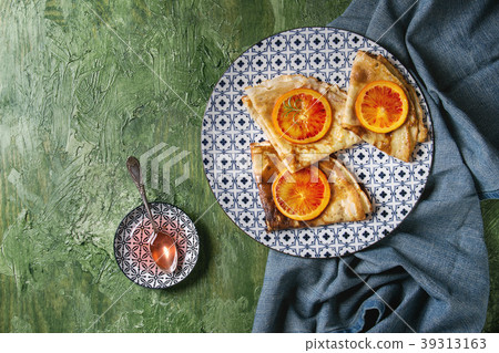 Pancakes with bloody oranges 39313163