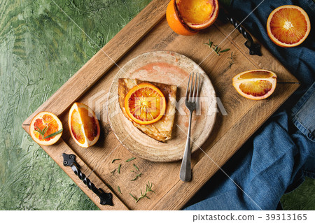 Pancakes with bloody oranges 39313165