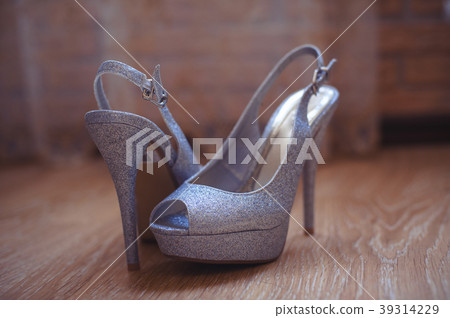 female shoes are lying on the floor female shoes are lying on the floor 39314229