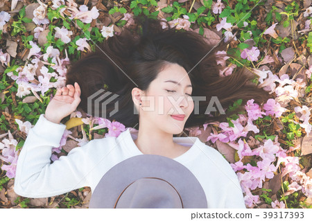 Young woman on pink flower garden, Spring Young woman on pink flower garden, Spring 39317393