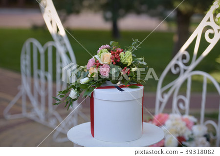 Small white table with weding accessories outdoors Small white table with weding accessories outdoors 39318082