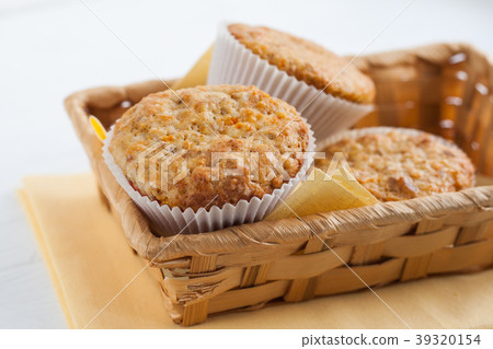 bright fragrant pumpkin cup cakes, muffins in a ba 39320154