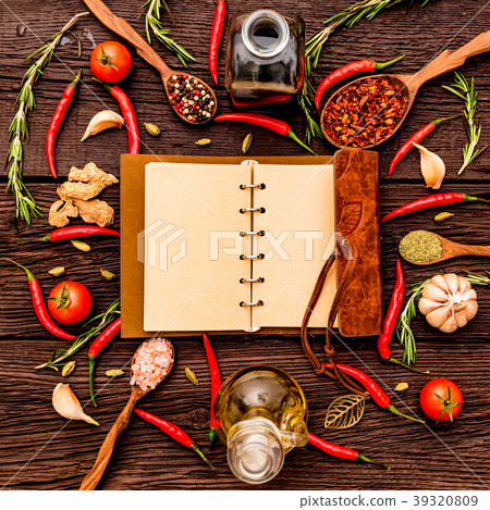 Open cook book and various spices composition Open cook book and various spices composition 39320809