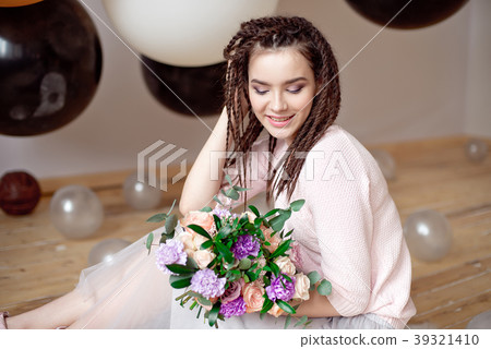 Smiling woman with dreadlocks hairstyle. Smiling woman with dreadlocks hairstyle. 39321410