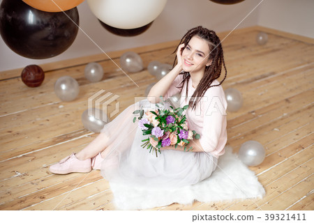 Smiling woman with dreadlocks hairstyle. Smiling woman with dreadlocks hairstyle. 39321411