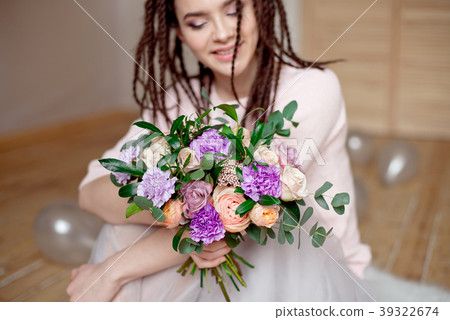 Smiling woman with dreadlocks hairstyle. 39322674