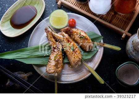Grilled chicken wings with teriyaki sauce. Grilled chicken wings with teriyaki sauce. 39323217