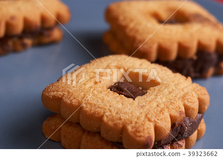 Chocolate sand chip cookies stacked up on a plate Chocolate sand chip cookies stacked up on a plate 39323662
